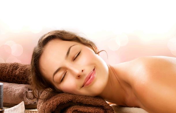Woman smiling as she waits for spa treatment