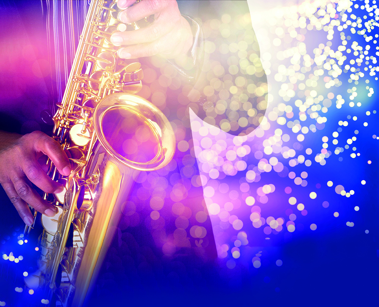 Person playing a saxophone with blurred colorful lights in the background.