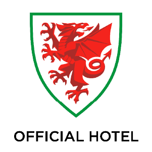 Red dragon on a white shield with green border above the text 