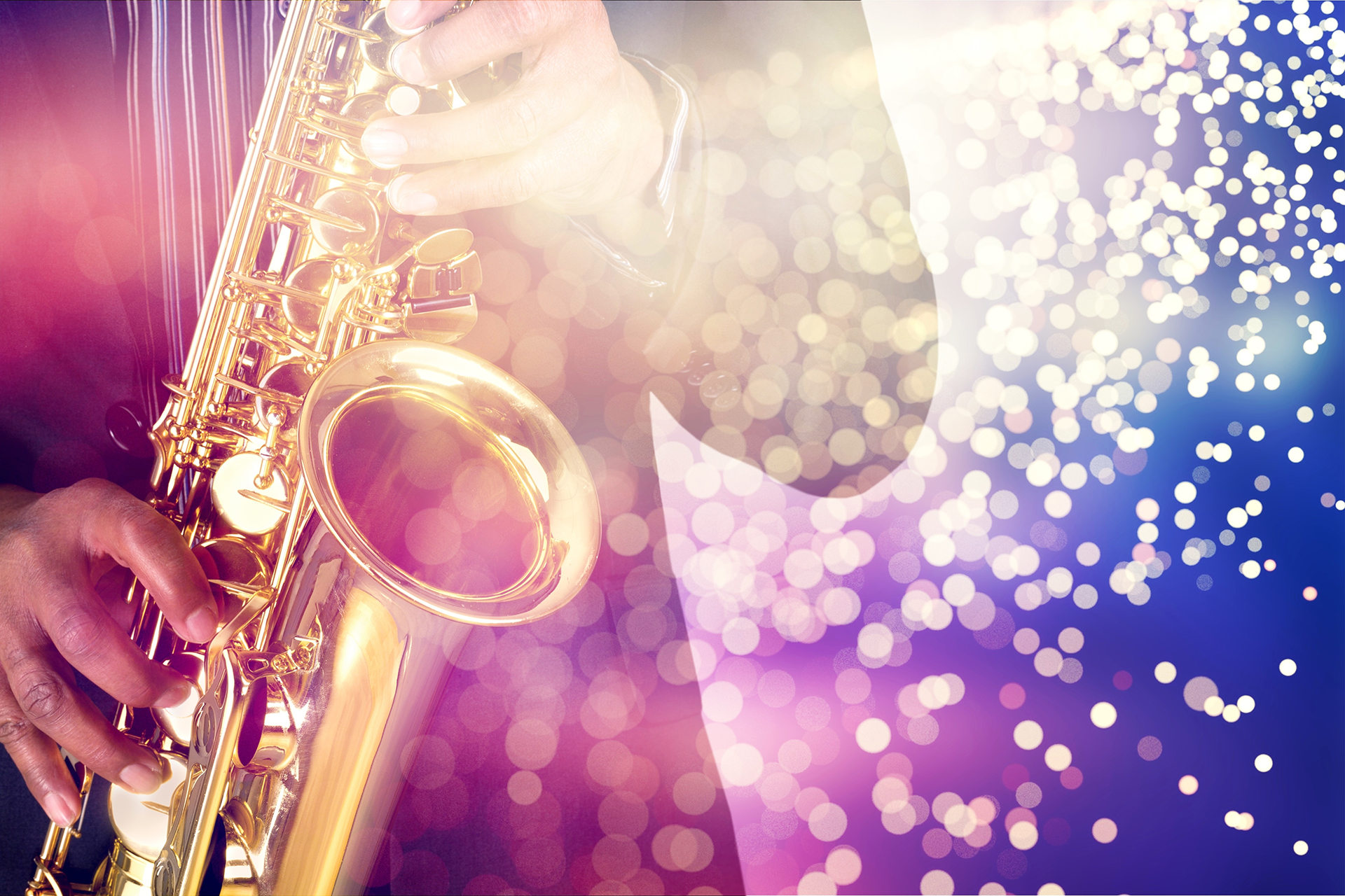 Hands playing a saxophone with a bright, sparkling background.